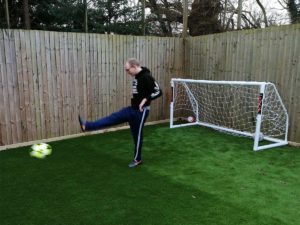 Tim enjoys a kick about on the newly-laid grass