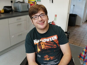 A man sitting in a kitchen