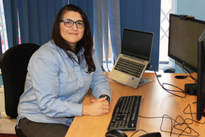 A woman sitting at a desk