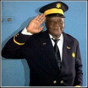 A picture of our support worker Uchenna's grandfather giving a salute in a smart uniform