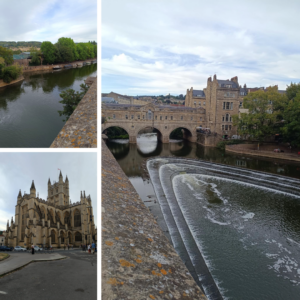 A river, a church, and a weir with a bridge over it.